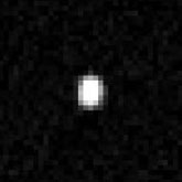 This actual Hubble image of Quaoar is a sum of sixteen separate exposures made with Hubble