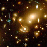 This new galaxy was detected in a long exposure of the nearby cluster of galaxies Abell 2218, taken with the Advanced Camera for Surveys on board the Hubble Space Telescope.: Image Courtesy NASA/ESA