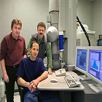 From left, Berkeley Lab scientists Nigel Browning, Alexander Ziegler (seated) and Robert Ritchie used this Scanning Transmission Electron Microscope to find new ways to toughen up advanced ceramics.
<P>
Courtesy Berkeley Lab