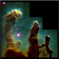The Eagle Nebula, as photographed by the Hubble Space Telescope. This famous photo, often known as 'The Pillars of Creation,' shows giant nebular clouds being evaporated by the ferocious energy of massive stars, exposing emerging solar systems, much like our own.
<P>
Credit: NASA/HST/Jeff Hester and Paul Scowen

