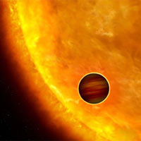 This is an artist’s impression of a Jupiter-sized planet passing in front of its parent star.<br /><br />Such events are called transits. When the planet transits the star, the star’s apparent brightness drops by a few percent for a short period. Through this technique, astronomers can search for planets across the galaxy by measuring periodic changes in a star’s luminosity.<br /><br />The first class of exoplanets found by this technique are the so-called 'hot Jupiters,' which are so close to their stars they complete an orbit within days, or even hours.<br /><br />Credits: NASA, ESA and G. Bacon