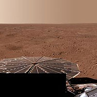 This partial view of a full-circle panorama shows NASA's Mars Phoenix Lander and the polygonal patterning of the ground at the landing area. The image is in approximately true color. <br /><br />Image credit: NASA/JPL-Caltech/University Arizona/Texas A&M University