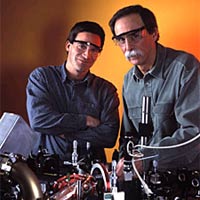 NIST physicists Dietrich Leibfried and David Wineland in the laboratory where they have developed a method for correcting data handling errors for quantum computing.
<P>
©Geoffrey Wheeler
