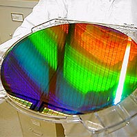 MIT’s Nanoruler was used to create parallel lines and spaces only 400 billionths of a meter apart (the diameter of a human hair is about 250 times larger) across this silicon wafer. The wafer is 12 inches in diameter.
<P>
Photo courtesy: Ralf Heilmann