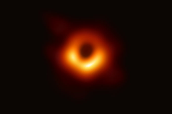 <p>The image shows a bright ring formed as light bends in the intense gravity around a black hole that is 6.5 billion times more massive than the Sun. Credit: Event Horizon Telescope Collaboration</p>

<p> </p>
