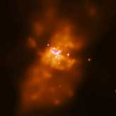 M82, at a distance of 11 million light years, is a rare nearby starburst galaxy where stars are forming and expiring at a rate ten times higher than in our galaxy.: Image Courtesy (NASA/CXC/SAO/PSU/CMU)