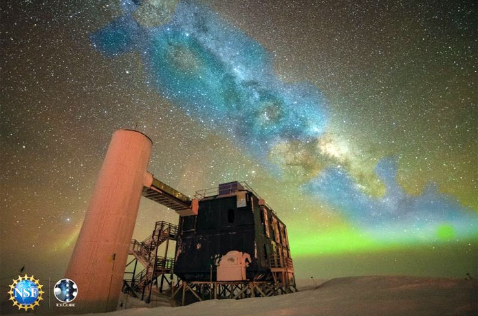 <p>An artist's composite image of a photo of the above-ground portion of the IceCube Neutrino Observatory along with the first-ever neutrino-based image of the Milky Way. The detected neutrinos, depicted in blue, are shown positioned in their approximate location relative to the more familiar optical view of the Milky Way galaxy.<br />
Credit: IceCube Collaboration (Yuya Makino)/U.S. National Science Foundation</p>
